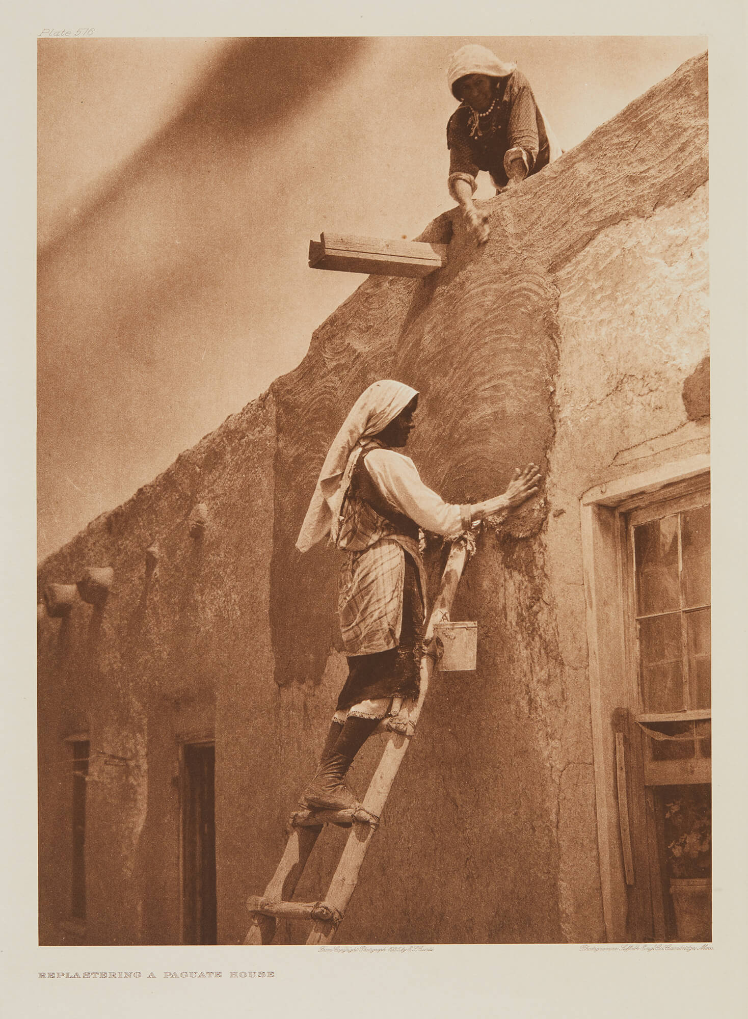 Edward S. Curtis - Replastering Paguate House - The North American Indian